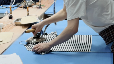 ironing workshop of hersweaters sweater factory, knitwear manufacturers